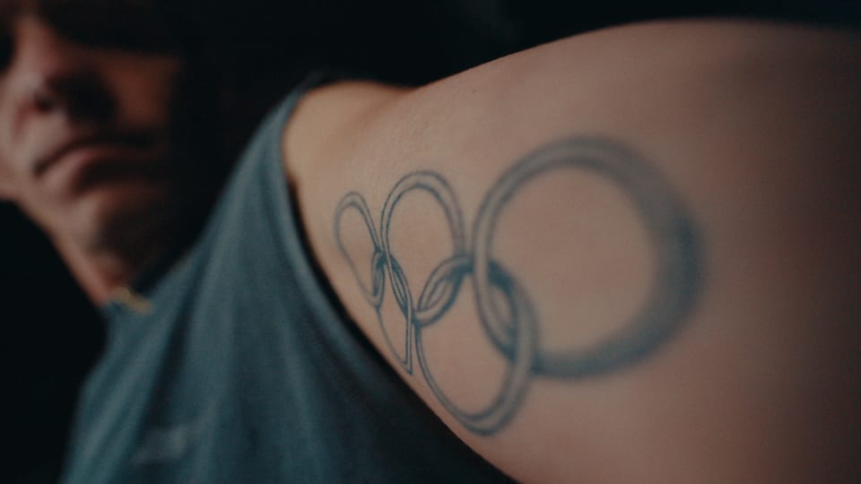 Olympic rings tattoo on an athlete's arm